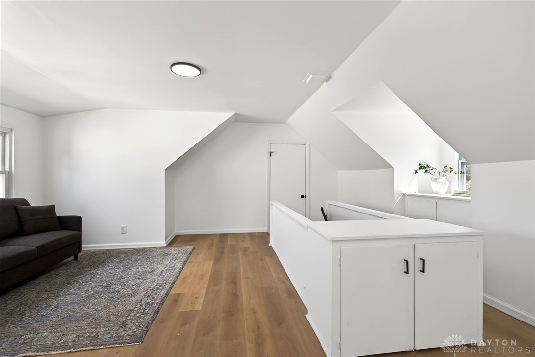 1243 Ridgeview Avenue Dayton, OH 45409 - Photo 35 of 56 This bright and airy loft features durable hardwood flooring and vaulted ceilings, creating an open and inviting atmosphere.
