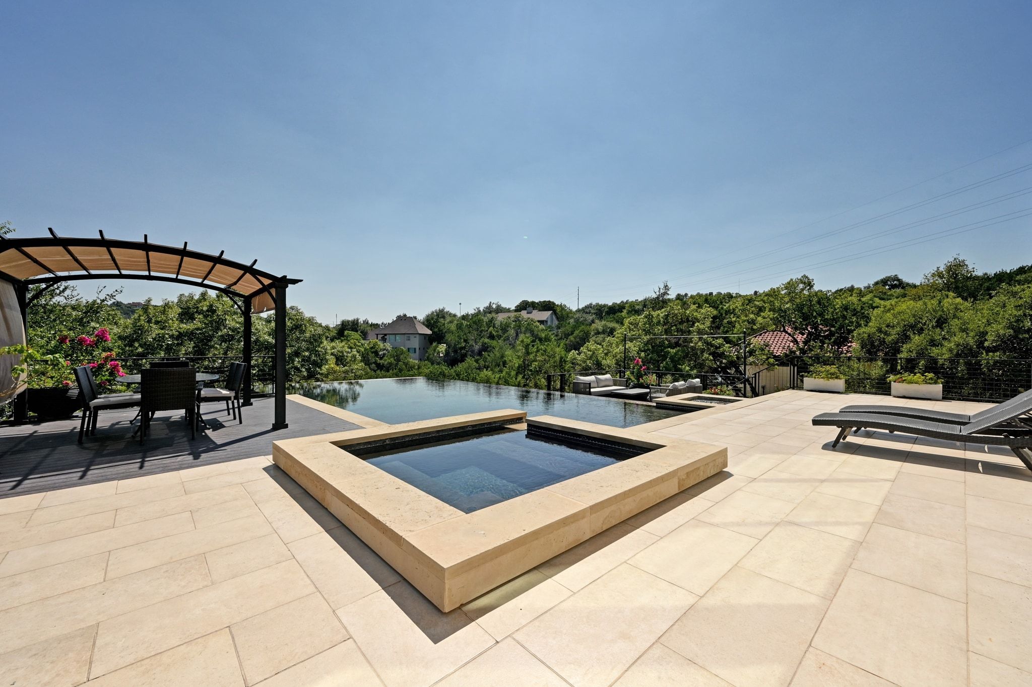 405 Barrett Lane Austin, TX 78733 - Photo 11 of 37 a view of swimming pool with seating area and trees in the background