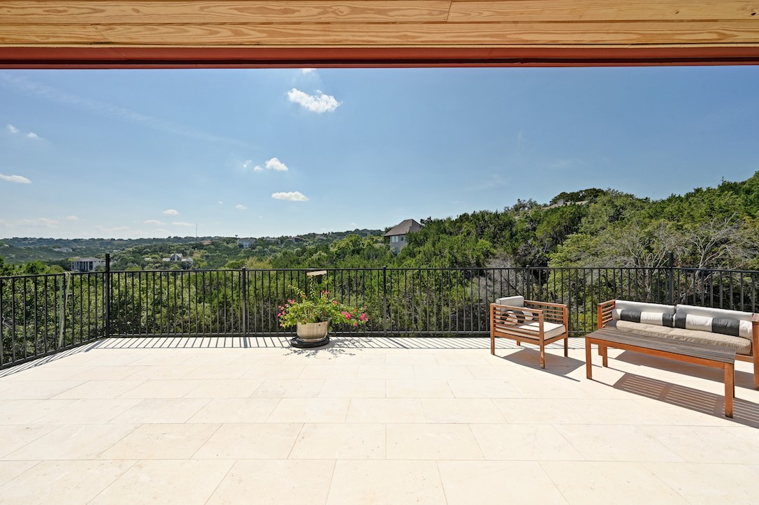 405 Barrett Lane Austin, TX 78733 - Photo 27 of 37 a view of a swimming pool with a lounge chair