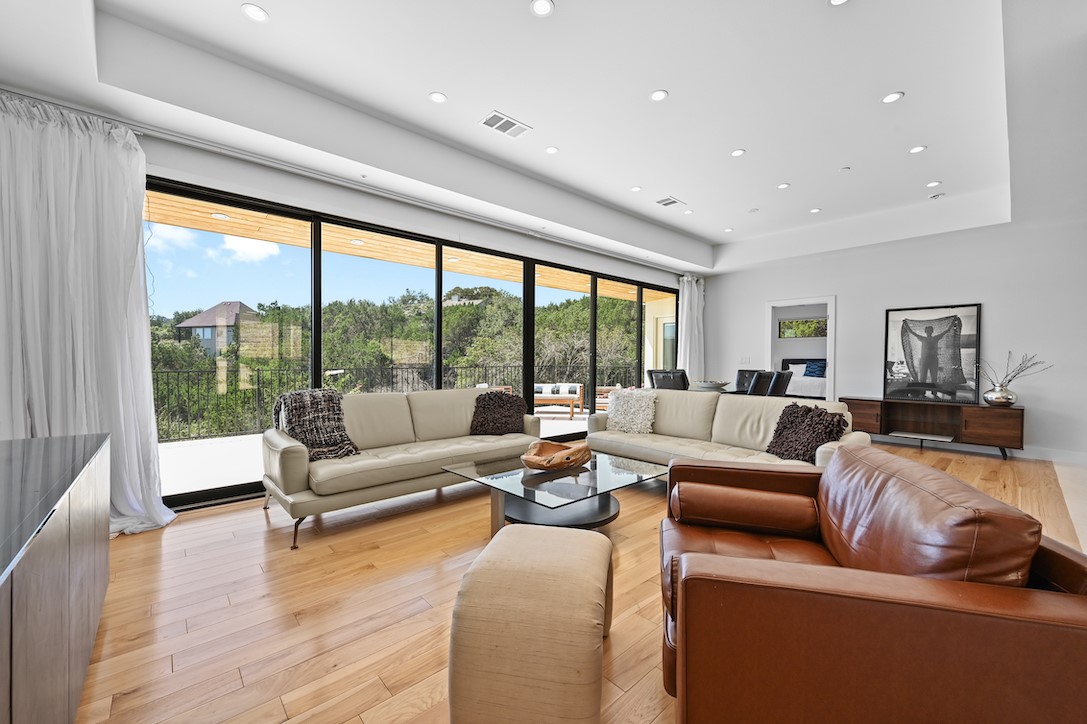 405 Barrett Lane Austin, TX 78733 - Photo 28 of 37 a living room with furniture and a large window
