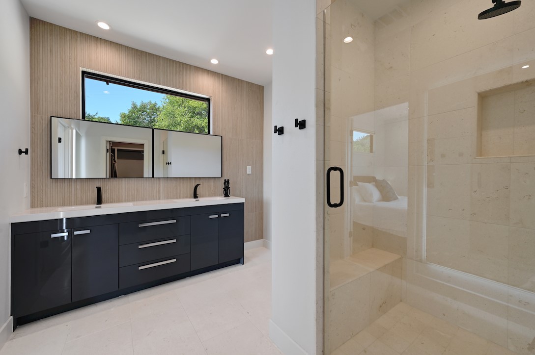 405 Barrett Lane Austin, TX 78733 - Photo 32 of 37 a bathroom with a double vanity sink mirror and shower