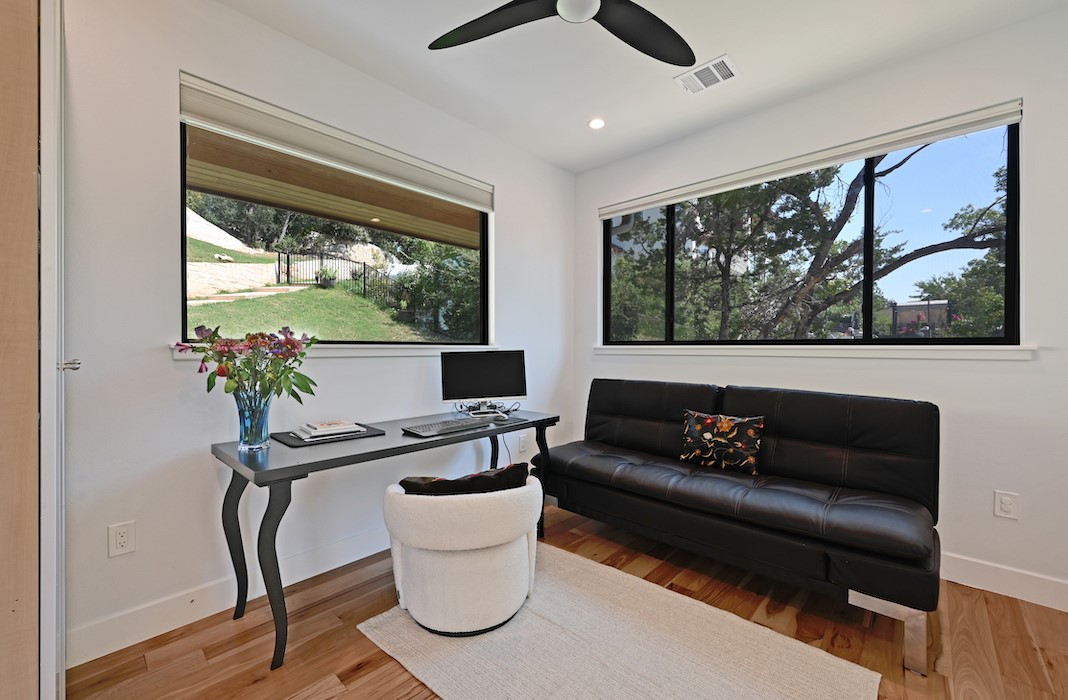 405 Barrett Lane Austin, TX 78733 - Photo 37 of 39 a living room with furniture and a potted plant