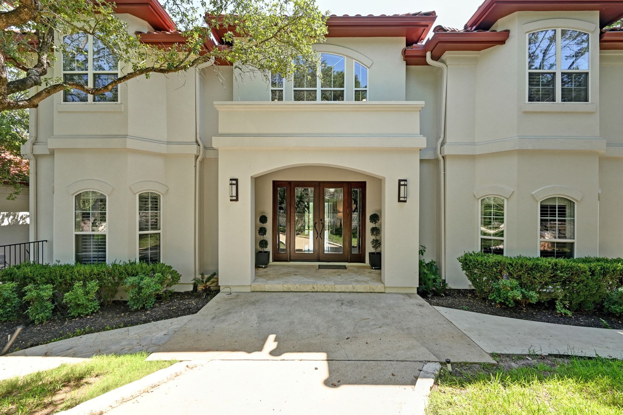 405 Barrett Lane Austin, TX 78733 - Photo 4 of 37 a front view of a house with a garden