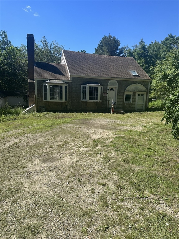 693 Orleans Road North Chatham, MA 02650 - Photo 41 of 41 a front view of a house with a garden