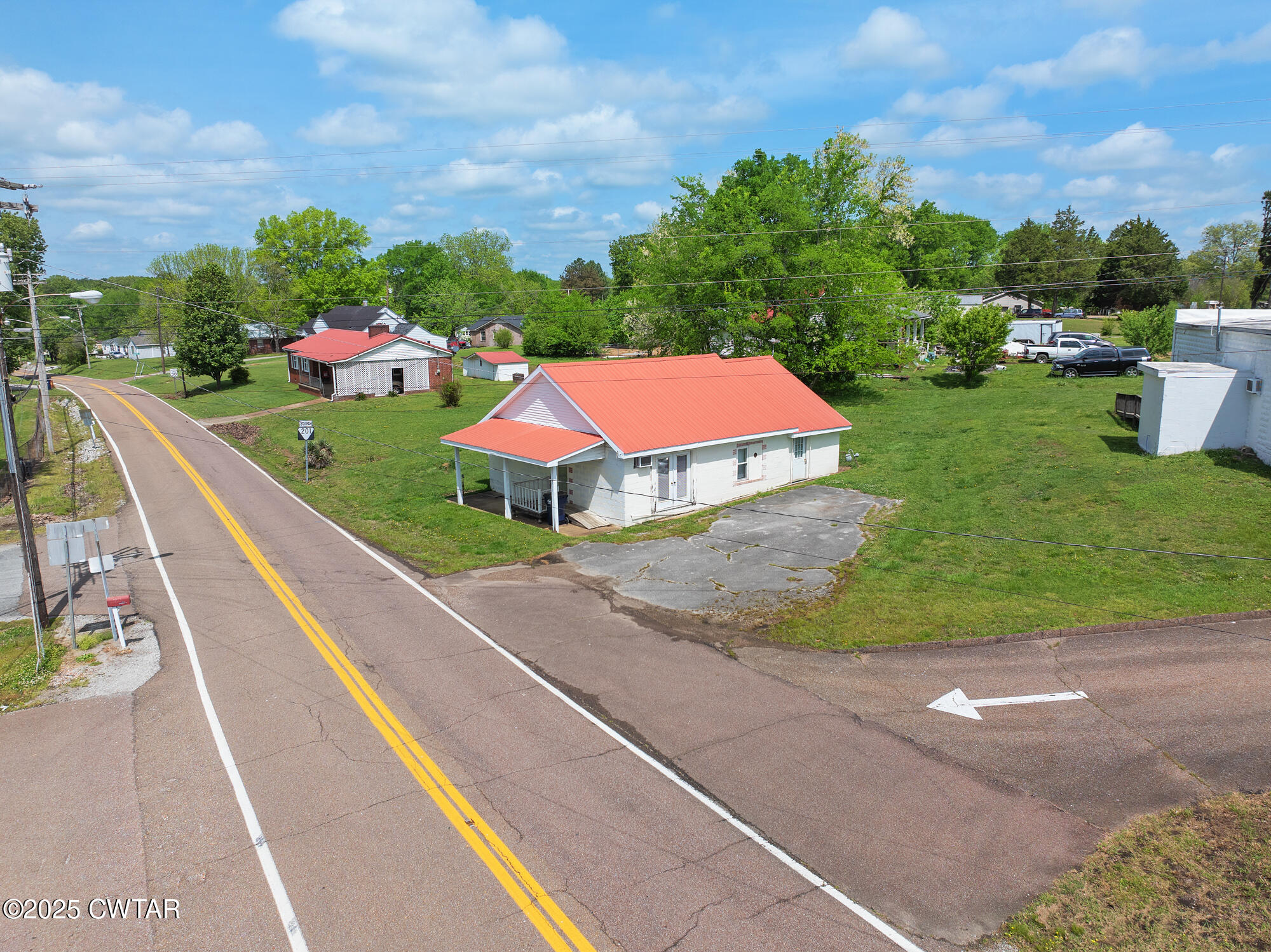 4555 Henderson Road Sardis, TN 38371 - Photo 17 of 19 a view of a street with houses