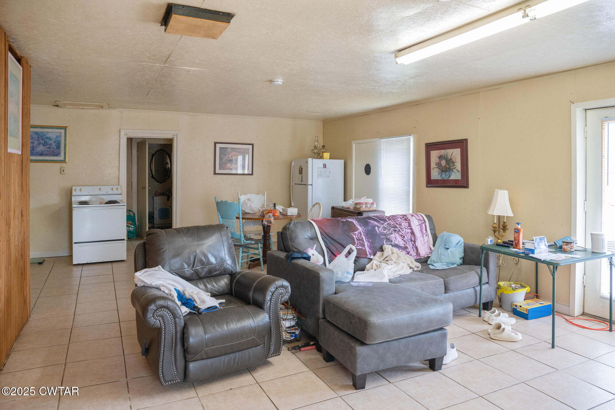 4555 Henderson Road Sardis, TN 38371 - Photo 4 of 19 a living room with furniture and a dining table with wooden floor