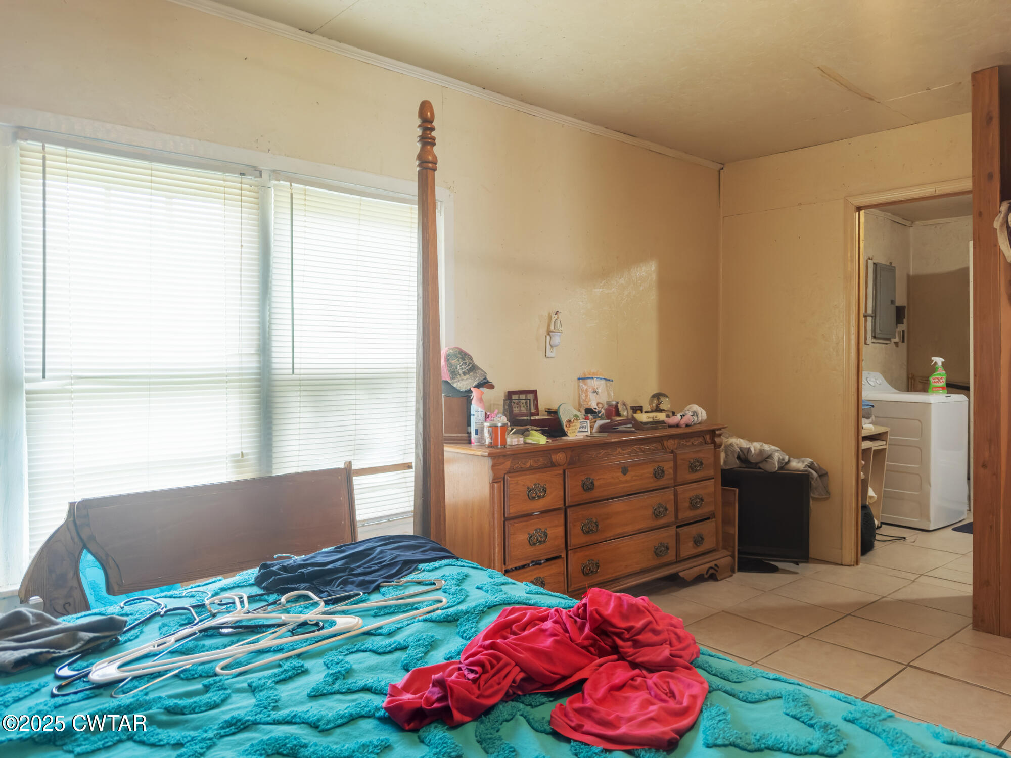 4555 Henderson Road Sardis, TN 38371 - Photo 10 of 19 a bedroom with a bed and a window