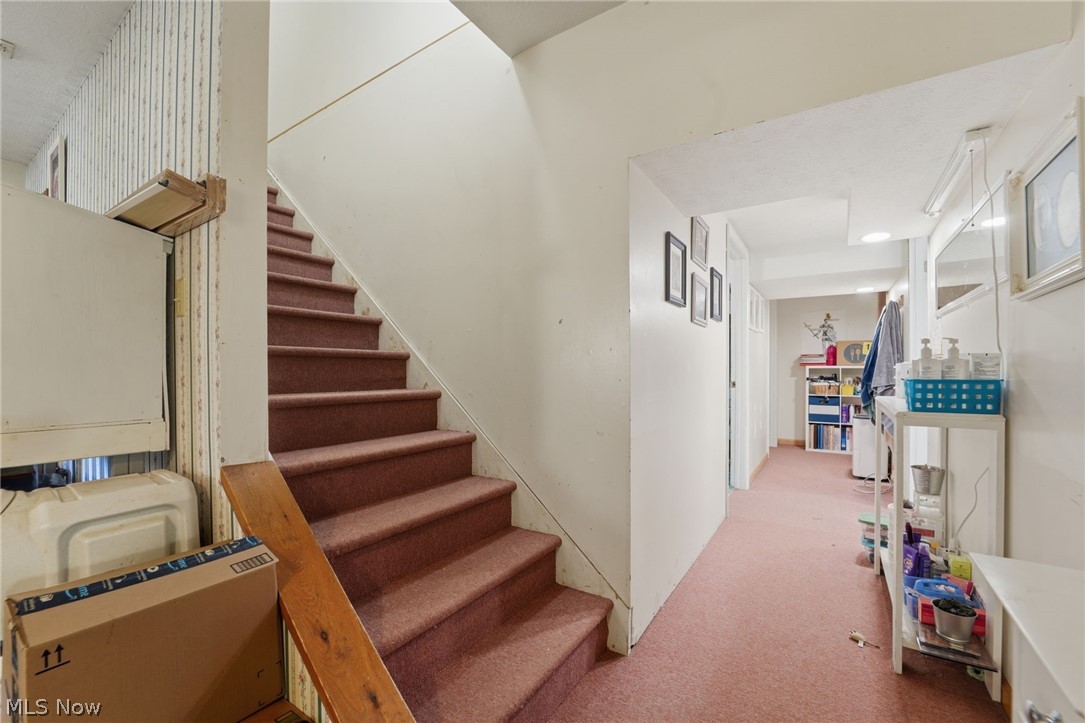 2932 Sexton Road Geneva, OH 44041 - Photo 23 of 41 Staircase with carpet floors