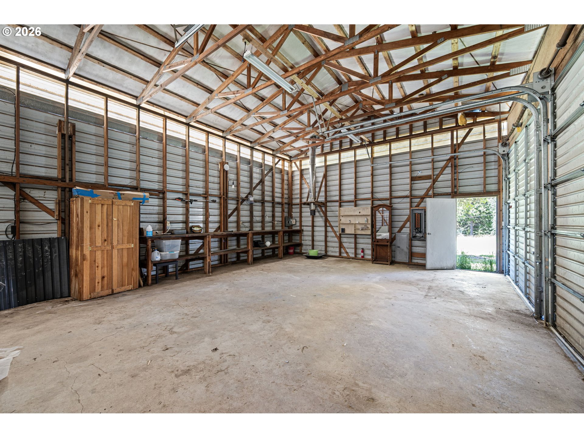 77521 Brock Road Oakridge, OR 97463 - Photo 23 of 48 a view of an empty room with wooden walls