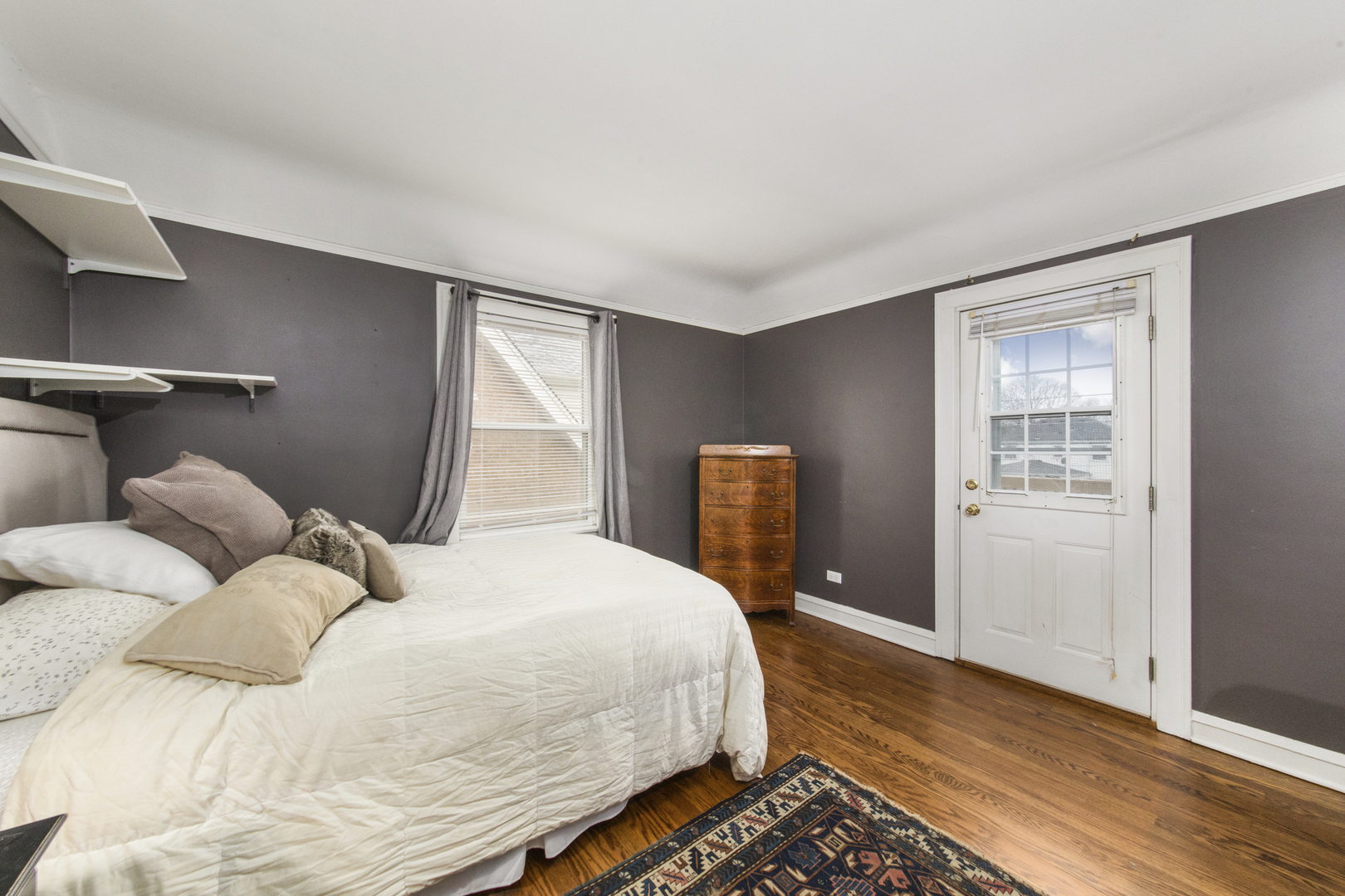 904 Harrison Street Park Ridge, IL 60068 - Photo 11 of 20 a bedroom with a bed and wooden floor