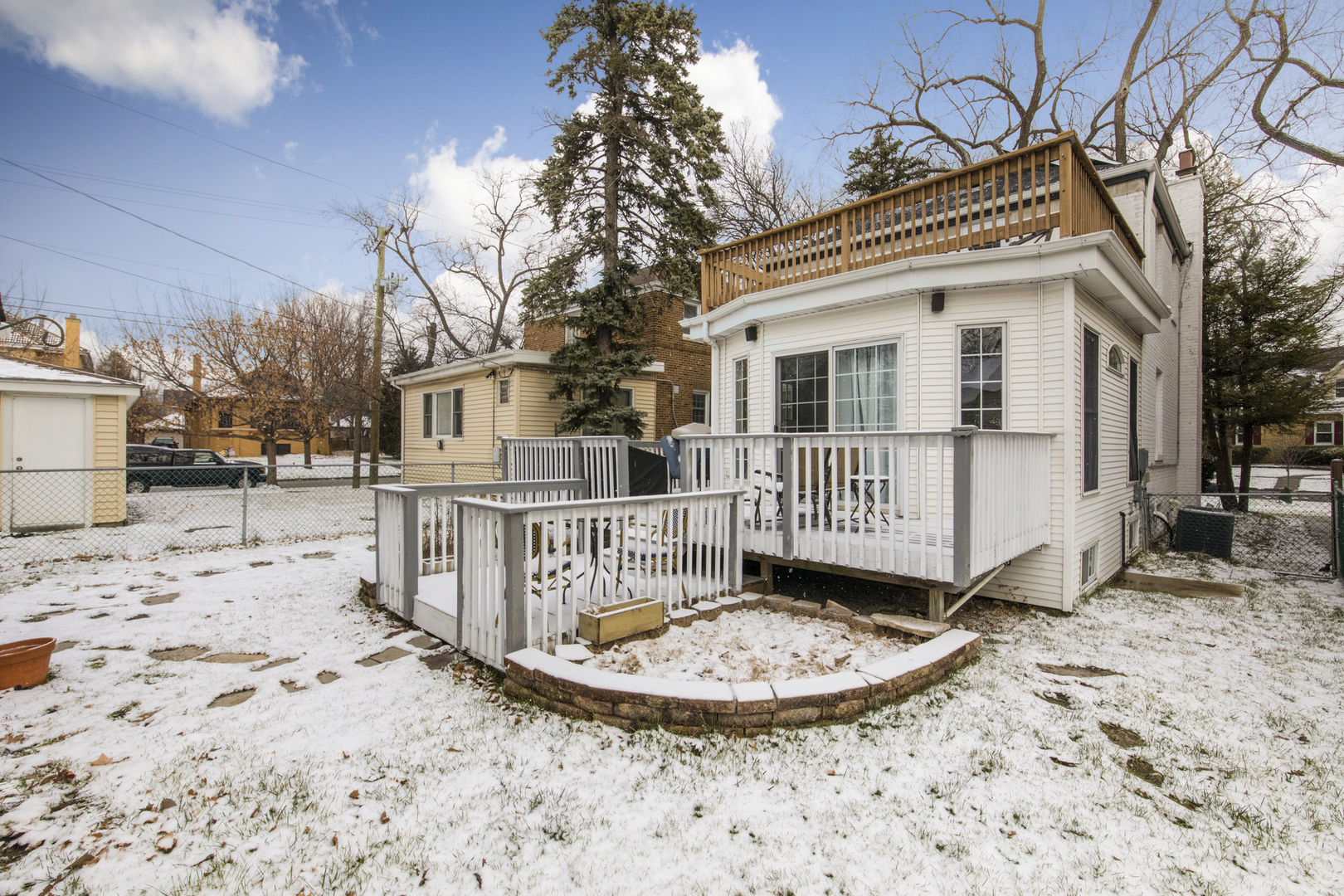 904 Harrison Street Park Ridge, IL 60068 - Photo 16 of 20 a view of a house with a wooden fence