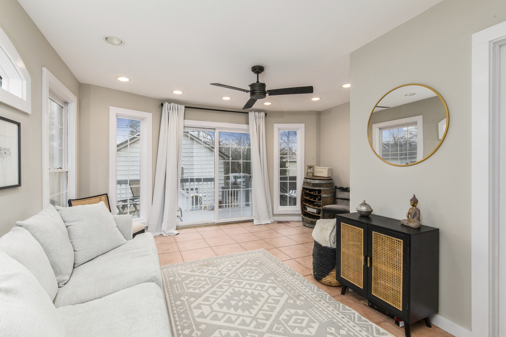 904 Harrison Street Park Ridge, IL 60068 - Photo 6 of 20 a living room with furniture a large window and a chandelier