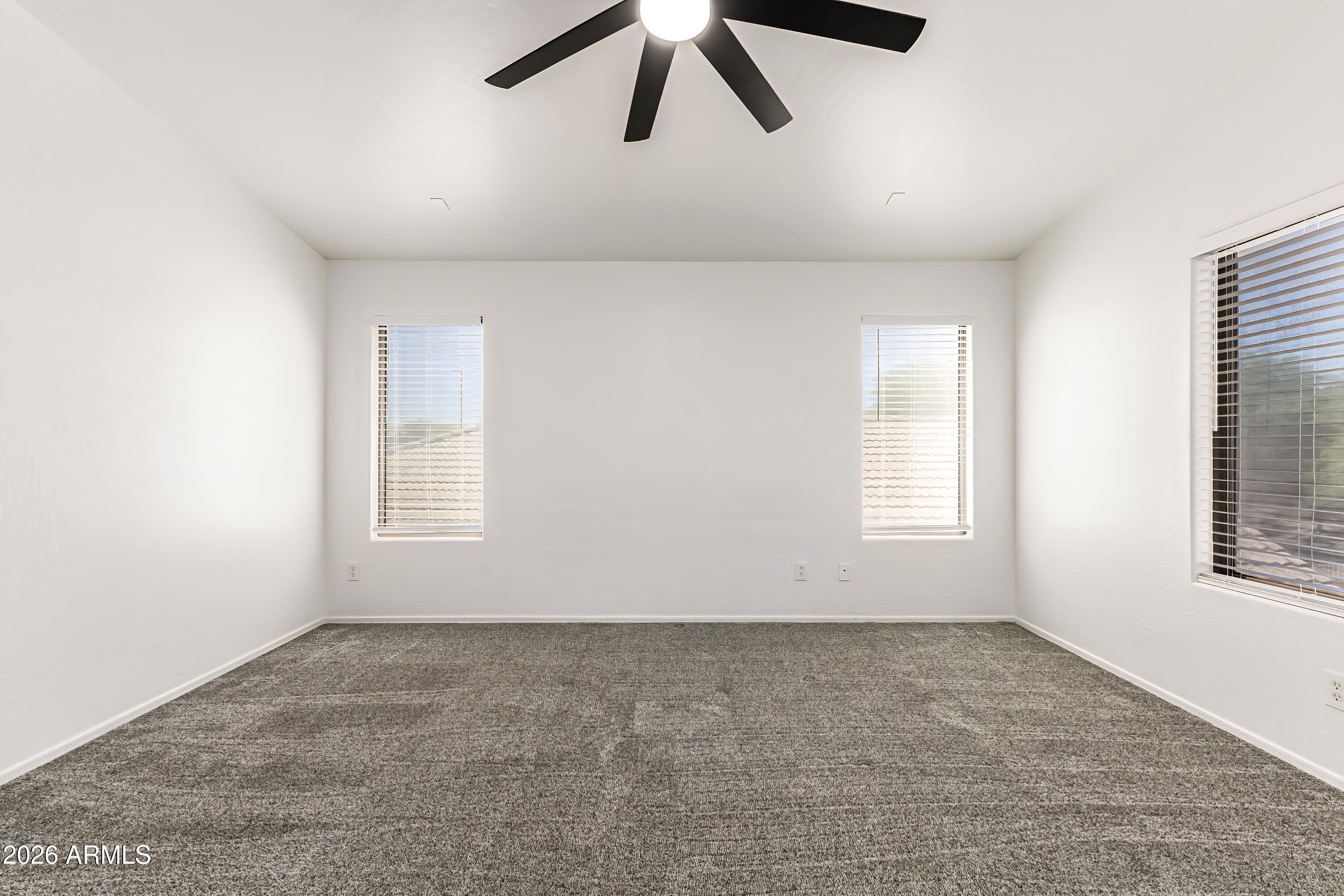 4208 South Sawmill Road Gilbert, AZ 85297 - Photo 19 of 46 wooden floor in an empty room with a window