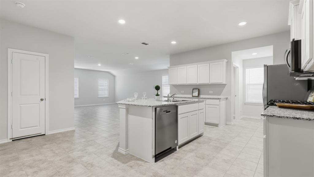 169 MLM Parkway Bridgeport, TX 76426 - Photo 2 of 21 a kitchen with sink stove and refrigerator