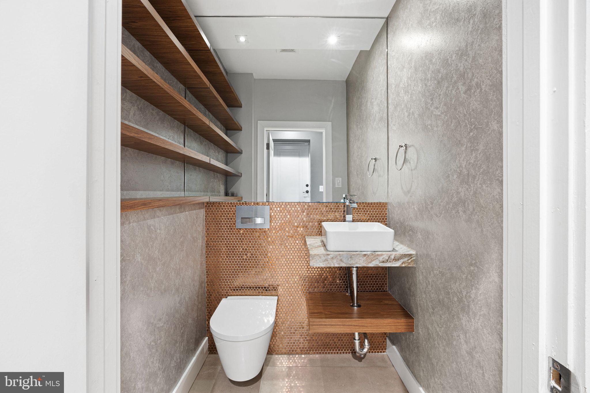 1224 Norwalk Road Philadelphia, PA 19115 - Photo 12 of 47 a bathroom with a toilet a sink and mirror