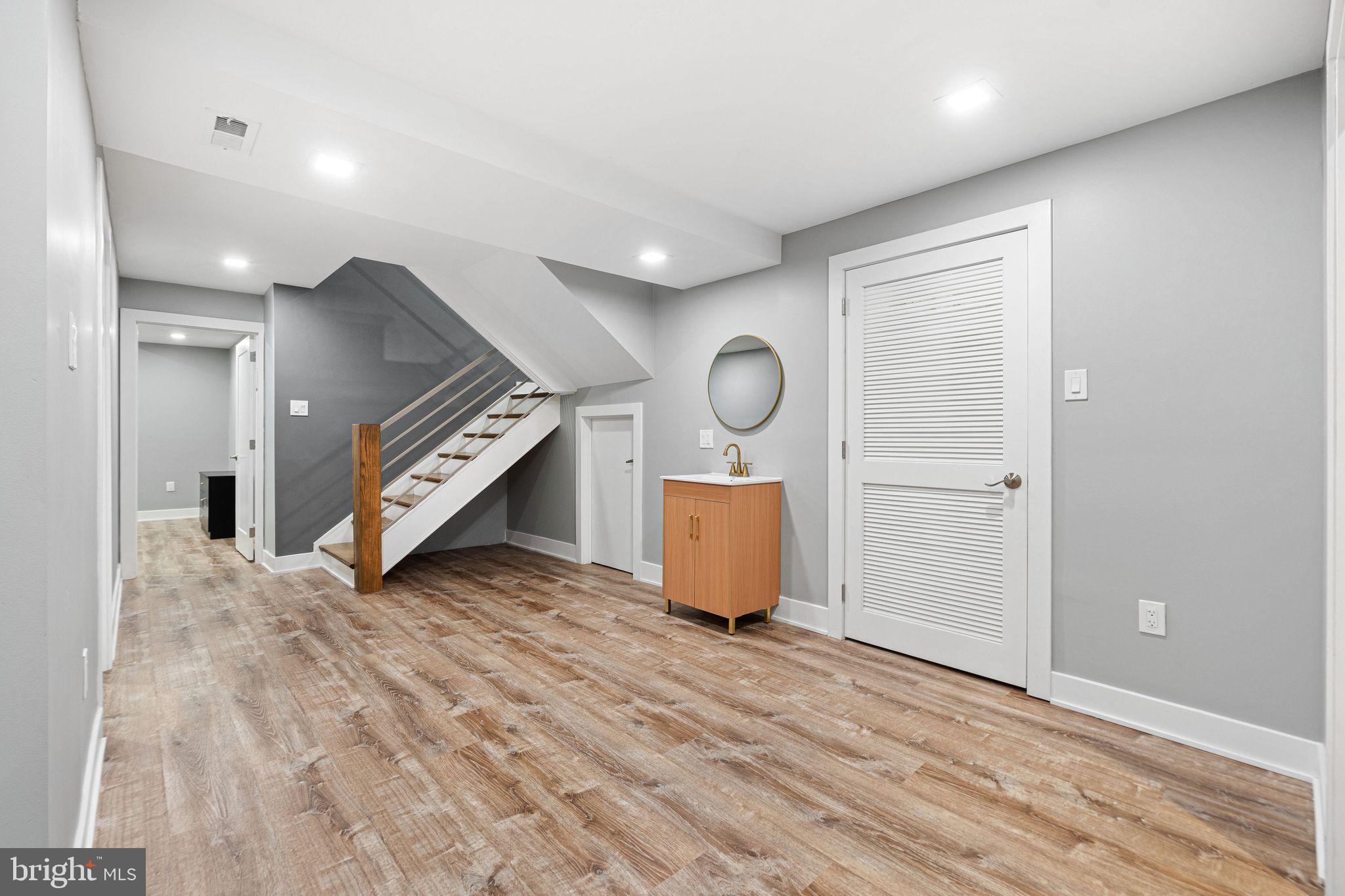 1224 Norwalk Road Philadelphia, PA 19115 - Photo 15 of 47 an empty room with wooden floor and windows