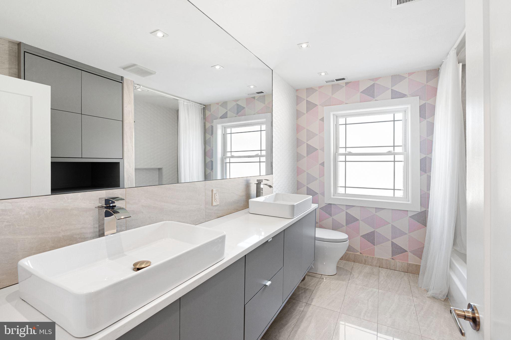 1224 Norwalk Road Philadelphia, PA 19115 - Photo 22 of 47 a spacious bathroom with a double vanity sink mirror and double