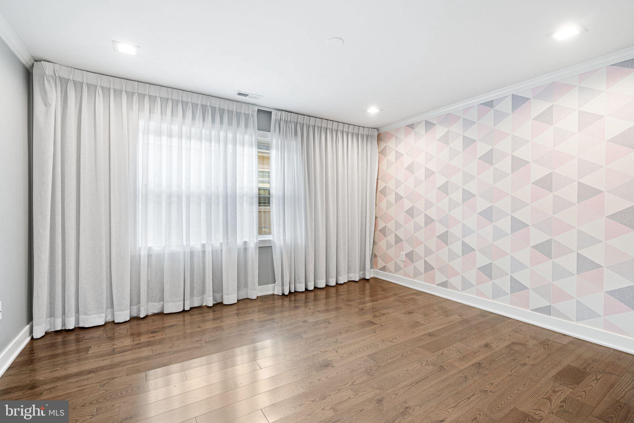 1224 Norwalk Road Philadelphia, PA 19115 - Photo 24 of 47 wooden floor in an empty room with a window