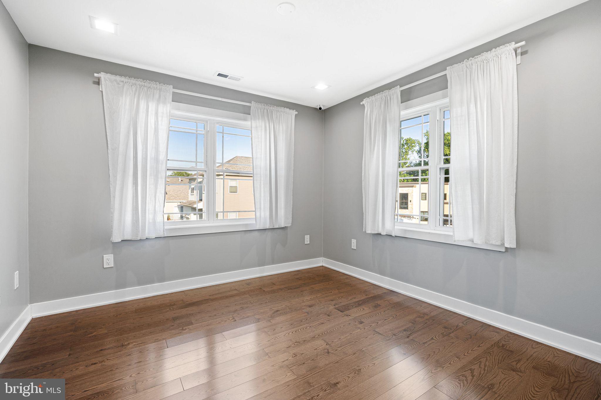 1224 Norwalk Road Philadelphia, PA 19115 - Photo 29 of 47 a view of an empty room with wooden floor and a window