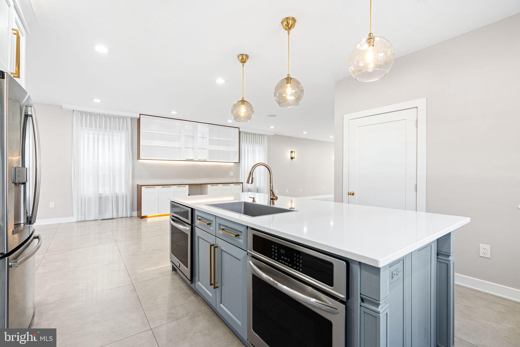 1224 Norwalk Road Philadelphia, PA 19115 - Photo 3 of 47 a kitchen with a sink and a stove top oven