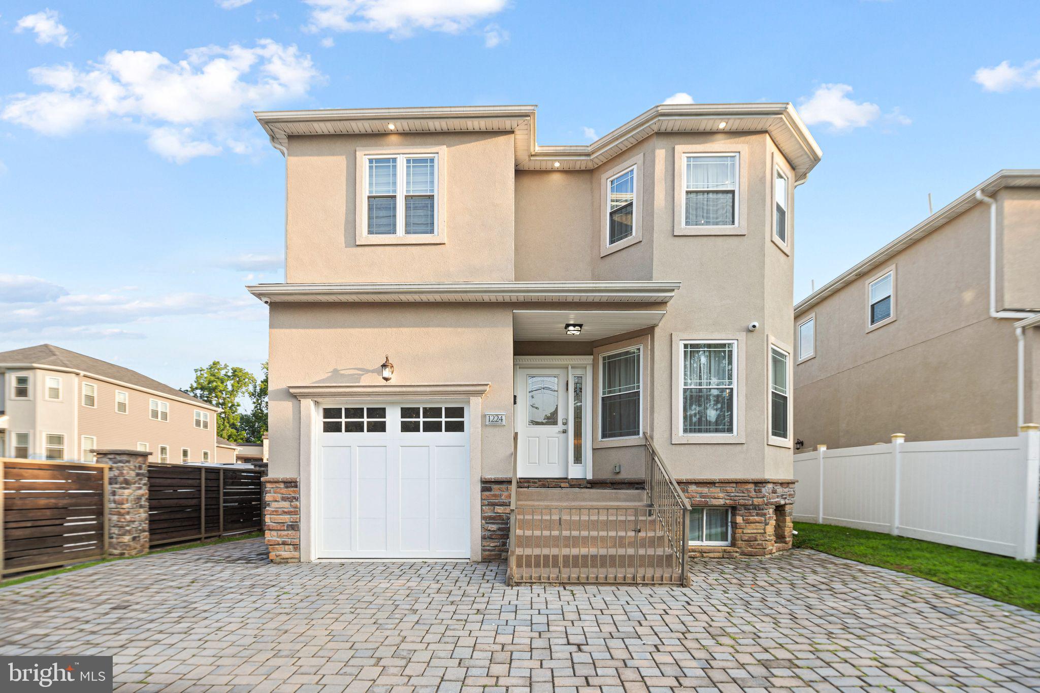 1224 Norwalk Road Philadelphia, PA 19115 - Photo 36 of 47 a front view of a house with a garden