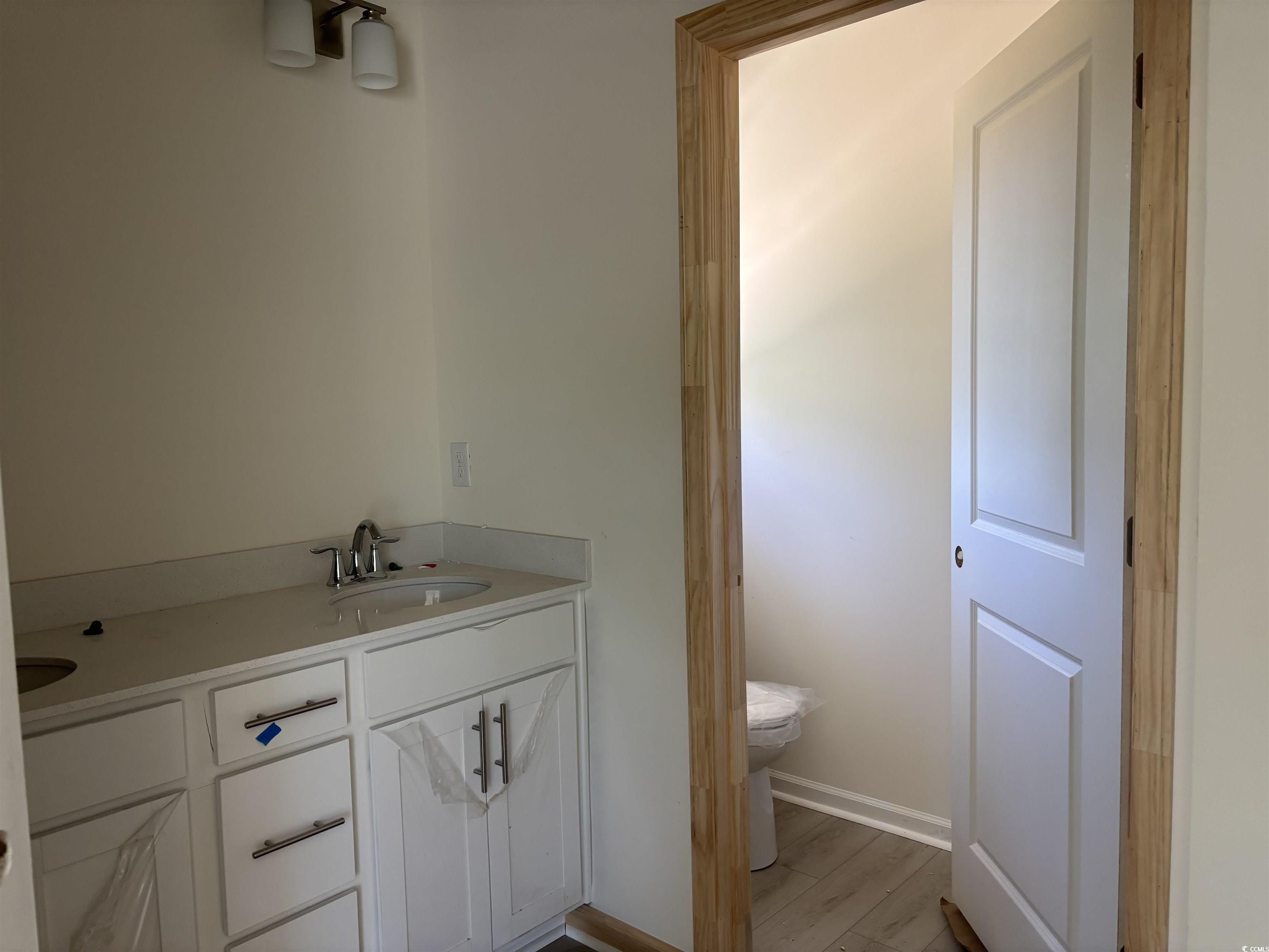 8545 Pee Dee Highway Conway, SC 29527 - Photo 18 of 34 Bathroom featuring toilet, wood finished floors, v