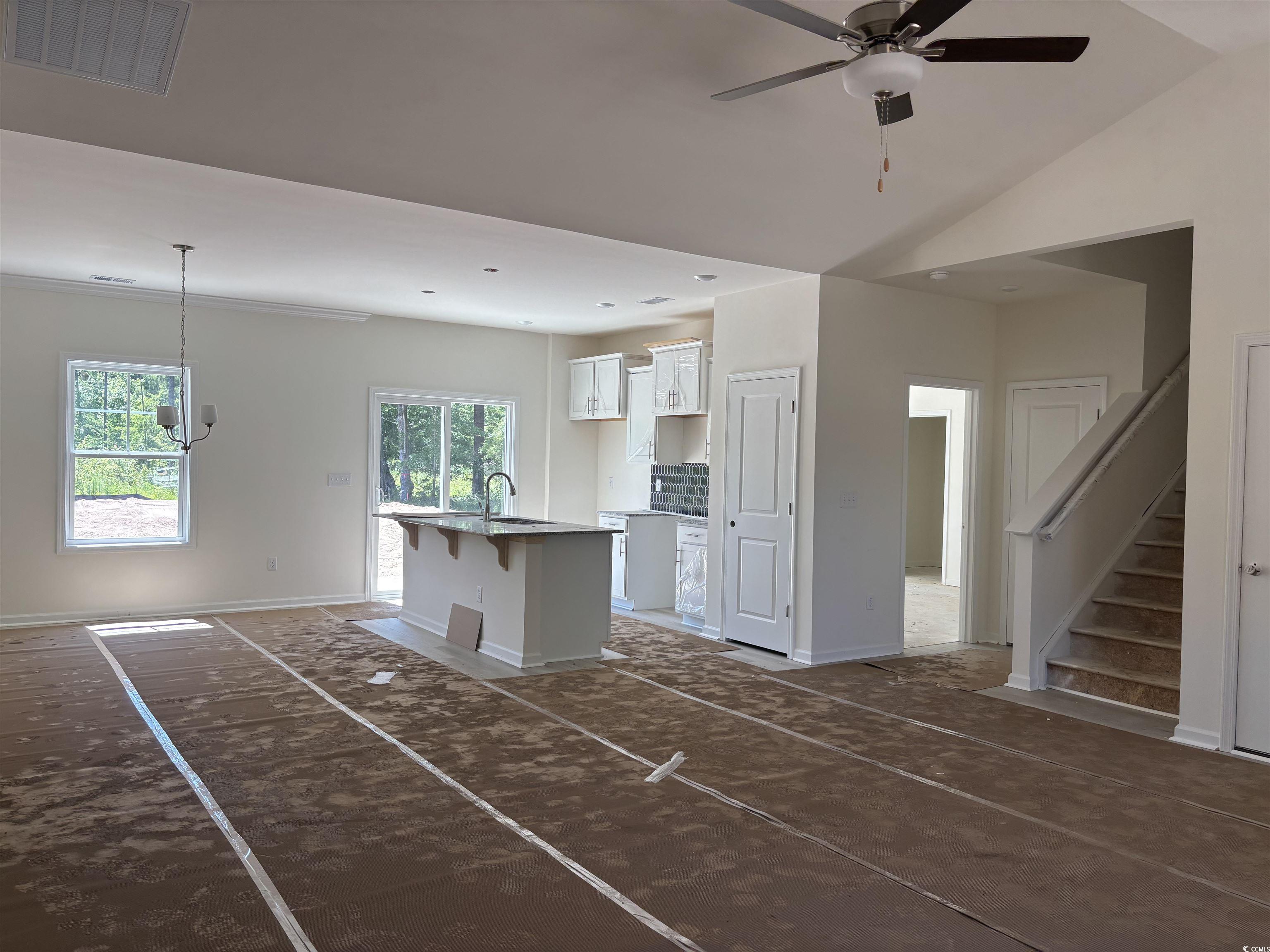 8545 Pee Dee Highway Conway, SC 29527 - Photo 7 of 34 Unfurnished living room featuring a chandelier, ba