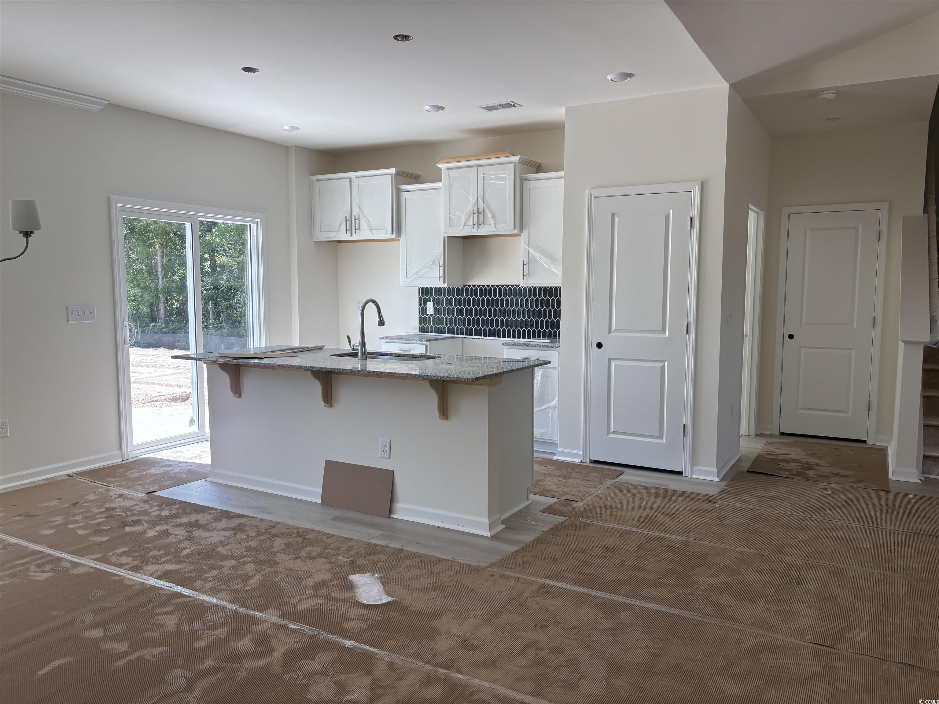 8545 Pee Dee Highway Conway, SC 29527 - Photo 9 of 34 Kitchen with a sink, a center island with sink, a