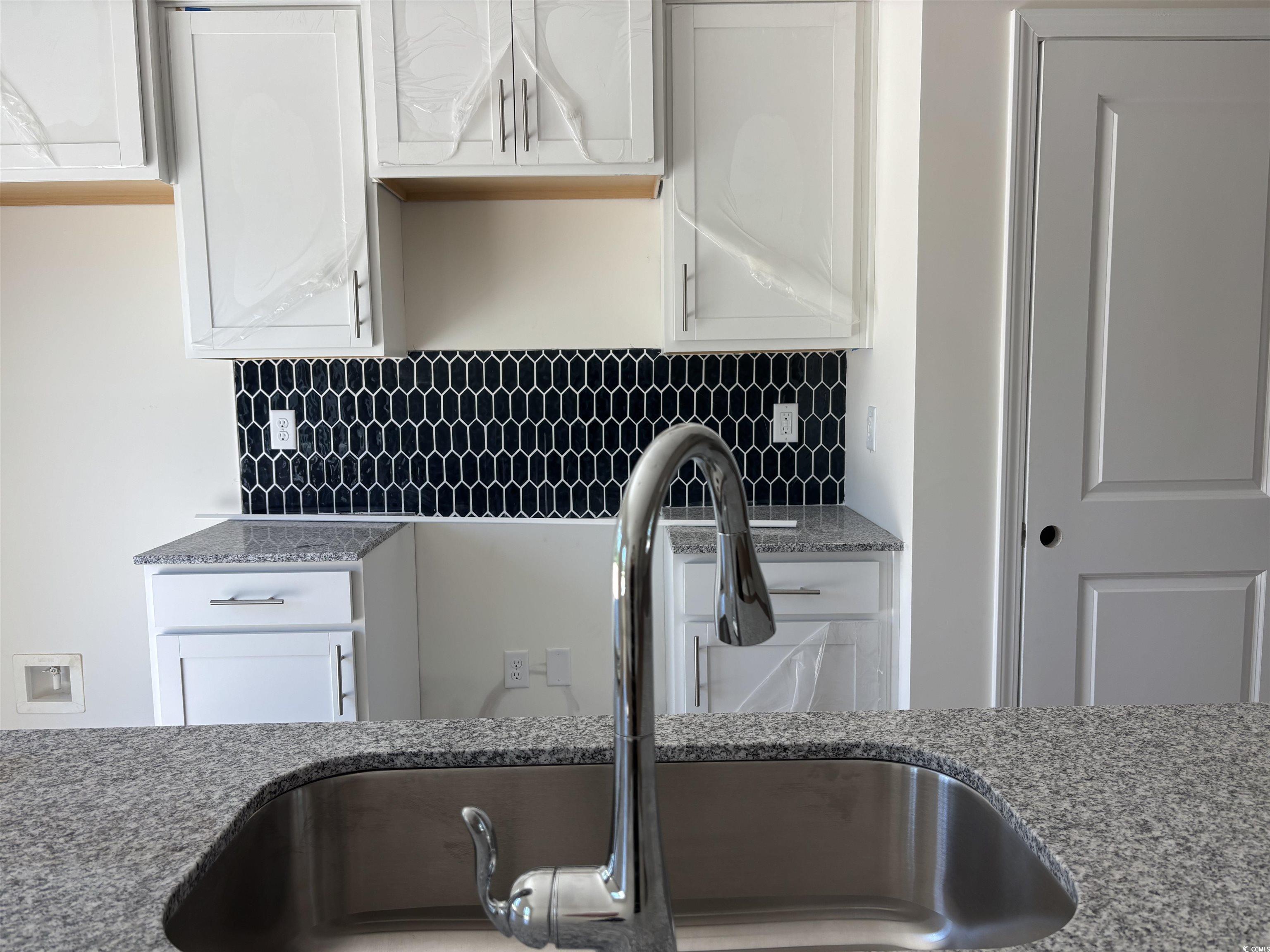 8545 Pee Dee Highway Conway, SC 29527 - Photo 10 of 34 Kitchen featuring a sink, light stone counters, wh