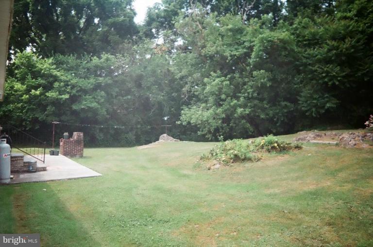 2191 Lewisville Road Summit Point, WV 25446 - Photo 2 of 18 a view of a backyard of the house