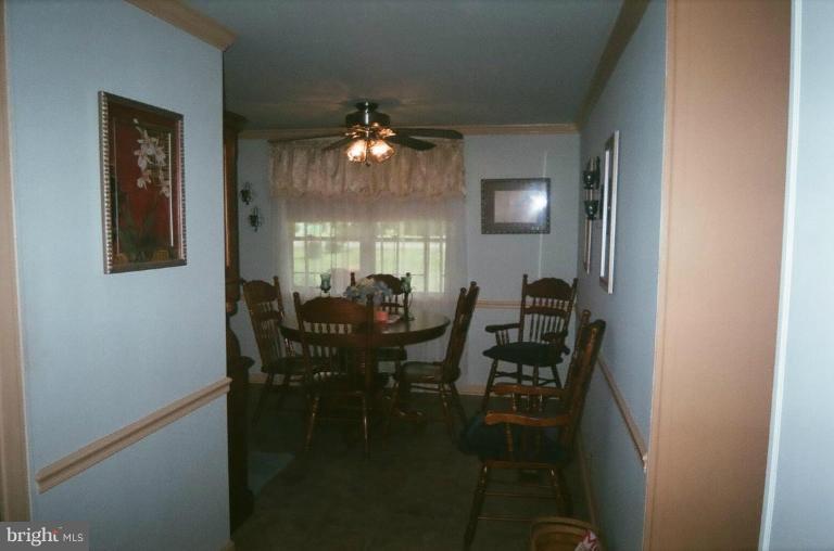 2191 Lewisville Road Summit Point, WV 25446 - Photo 14 of 18 a view of a dining room with furniture