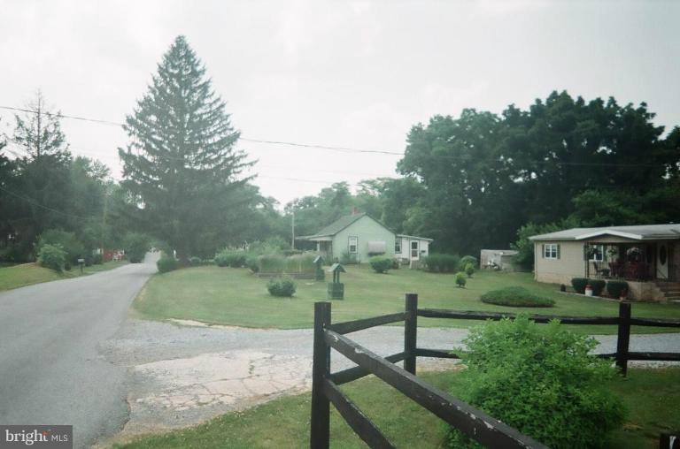 2191 Lewisville Road Summit Point, WV 25446 - Photo 18 of 18 a view of backyard with green space