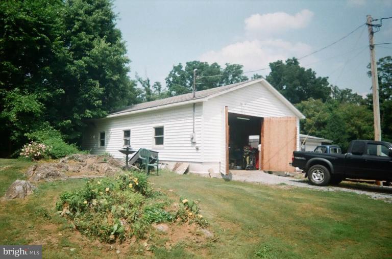 2191 Lewisville Road Summit Point, WV 25446 - Photo 5 of 18 a view of a house with backyard and garden