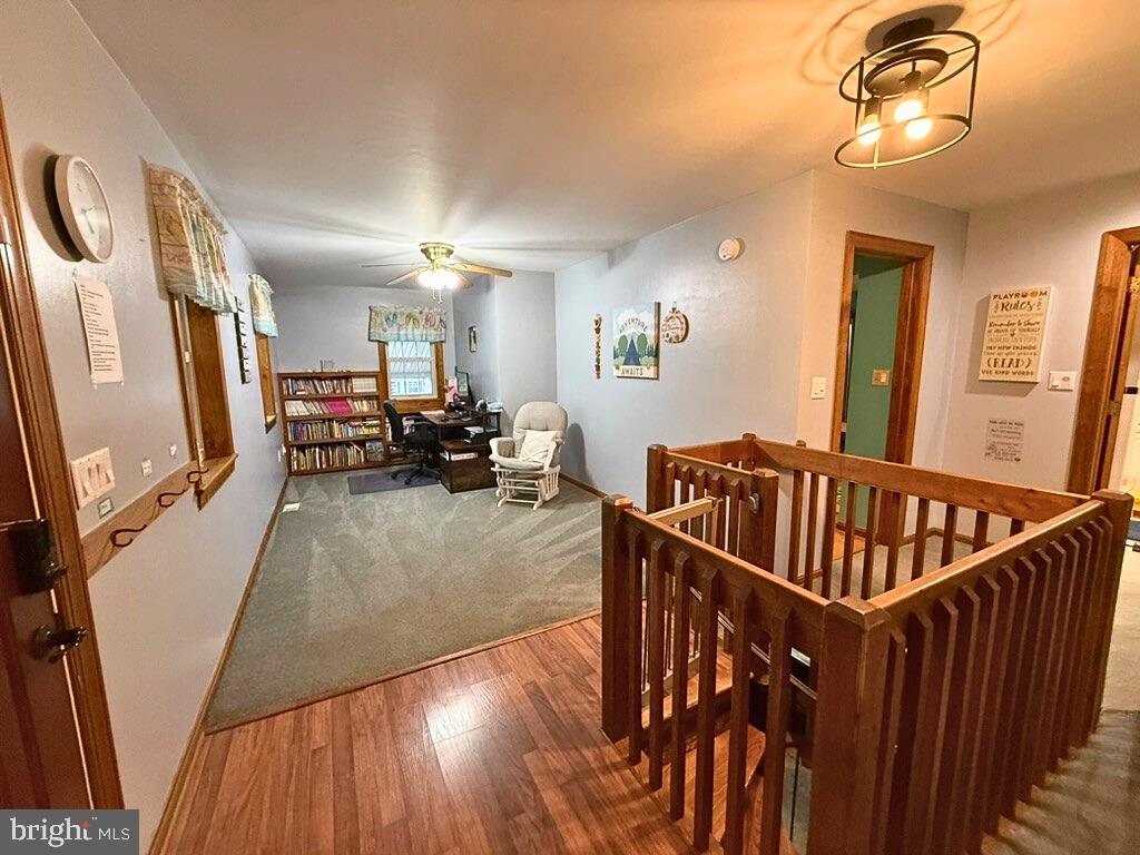 31569 Jim Davis Road Galena, MD 21635 - Photo 18 of 42 a view of a livingroom with furniture hardwood floor and staircase