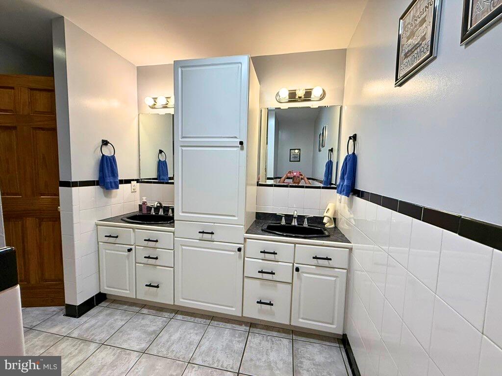 31569 Jim Davis Road Galena, MD 21635 - Photo 20 of 42 a kitchen with white cabinets and appliances