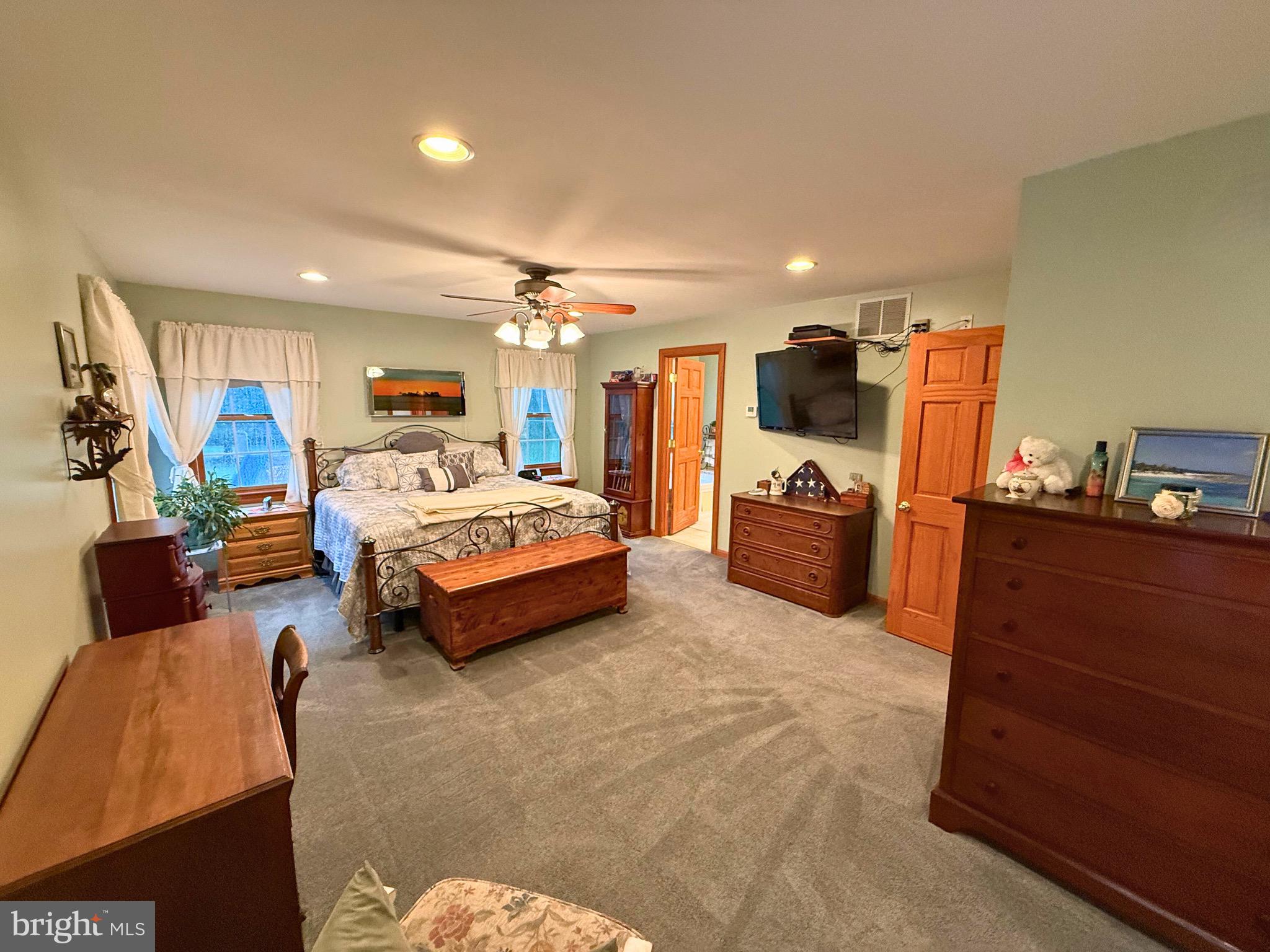 31569 Jim Davis Road Galena, MD 21635 - Photo 23 of 42 a bedroom with furniture and a flat tv screen