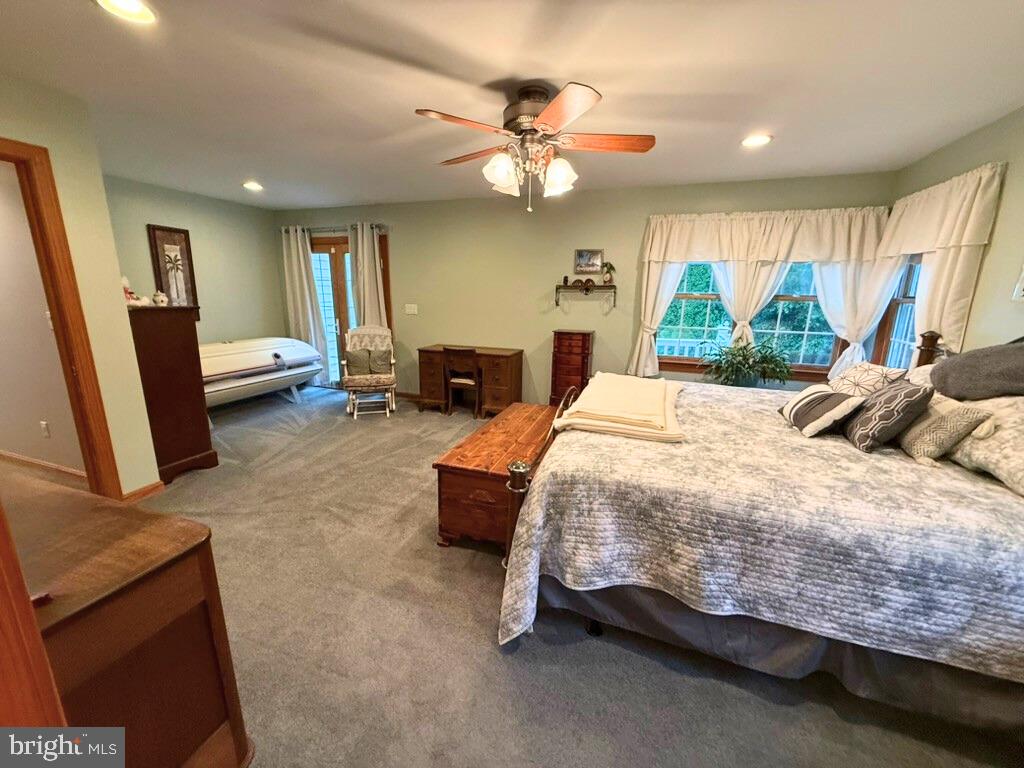 31569 Jim Davis Road Galena, MD 21635 - Photo 25 of 42 a bed sitting in a room next to a window