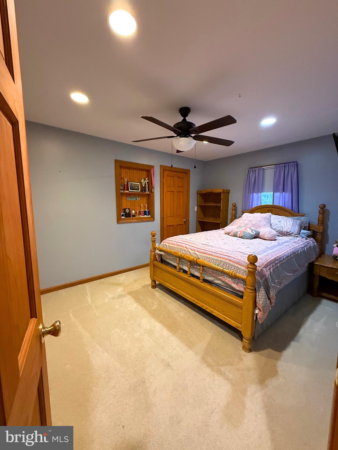 31569 Jim Davis Road Galena, MD 21635 - Photo 30 of 42 a bedroom with a bed and a ceiling fan