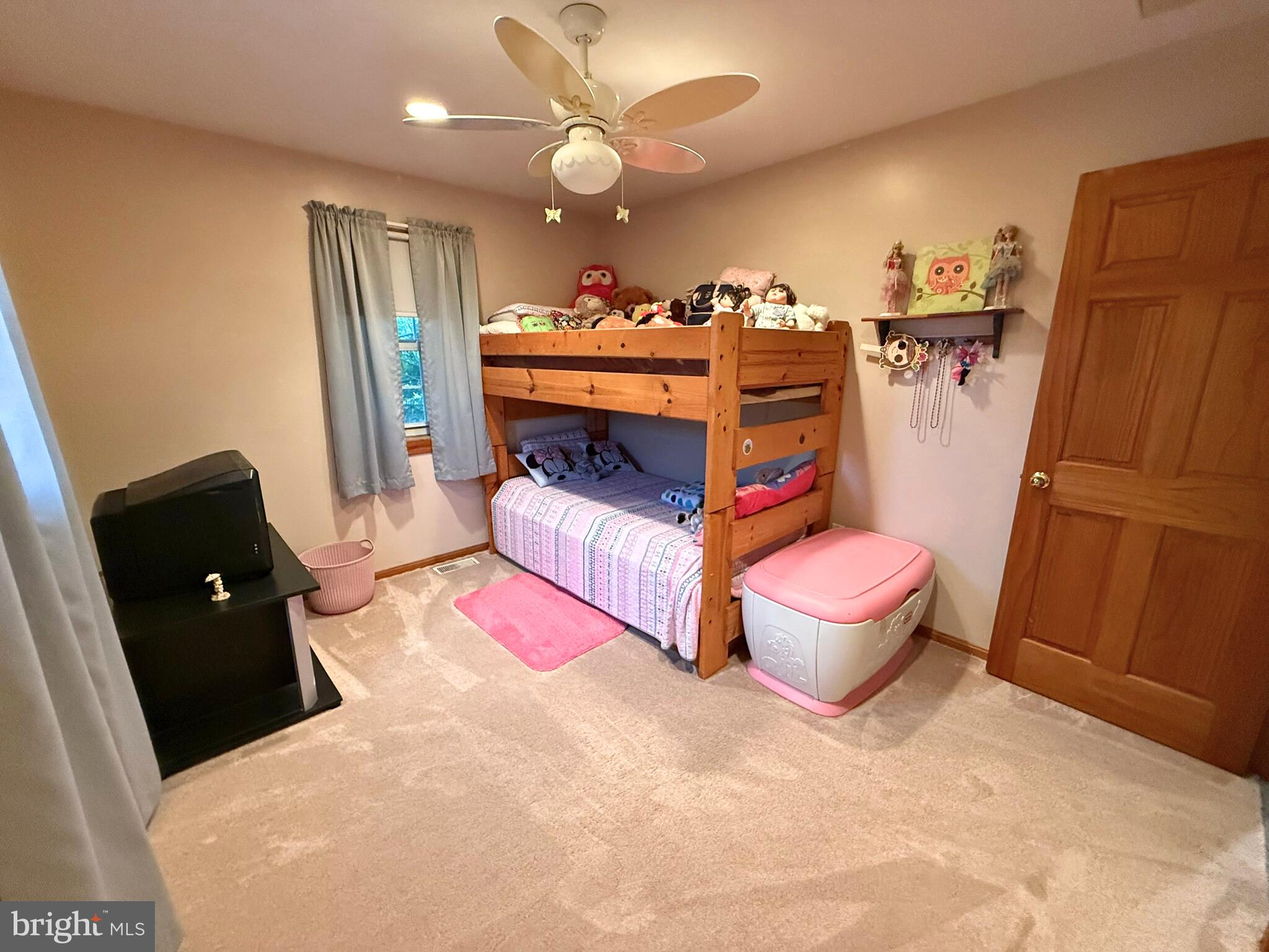 31569 Jim Davis Road Galena, MD 21635 - Photo 31 of 42 a bedroom with a bed and wooden floor