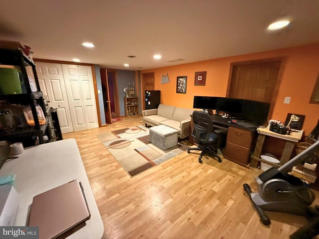 31569 Jim Davis Road Galena, MD 21635 - Photo 41 of 42 a living room with furniture a flat screen tv and gym equipment