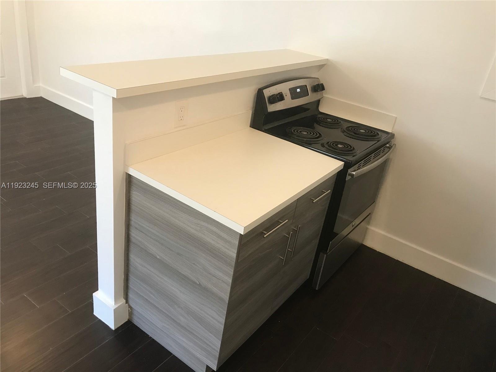 1040 Northwest 3rd Avenue, Unit 7 Miami, FL 33136 - Photo 7 of 15 a utility room with washer and dryer