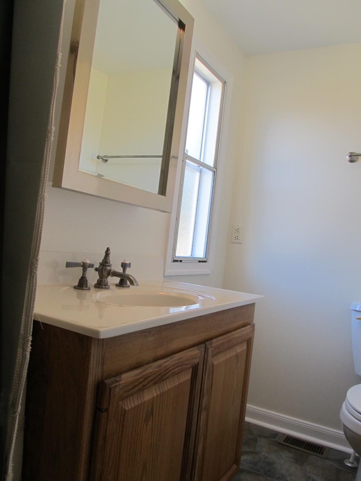 39 Harriston Road Grottoes, VA 24441 - Photo 8 of 38 a bathroom with a sink a toilet and mirror