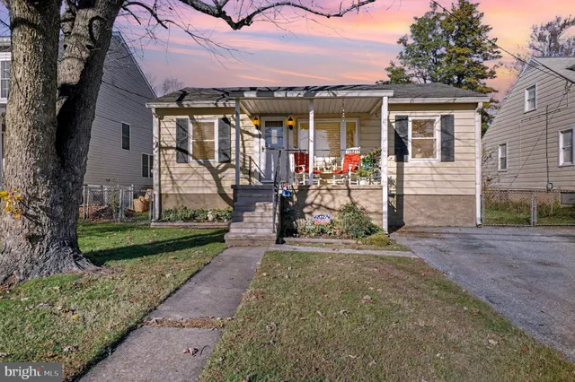 a view of a house with backyard porch and sitting area