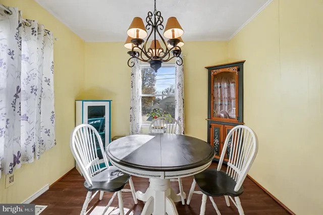 a view of kitchen with furniture and wooden floor