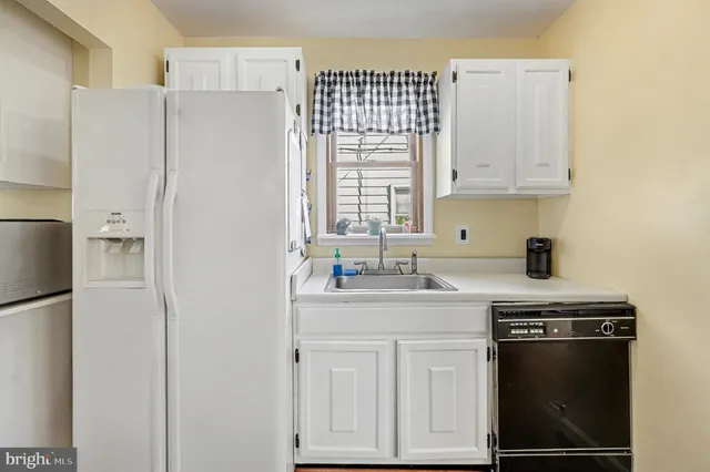 a kitchen with stainless steel appliances a stove a microwave and a refrigerator