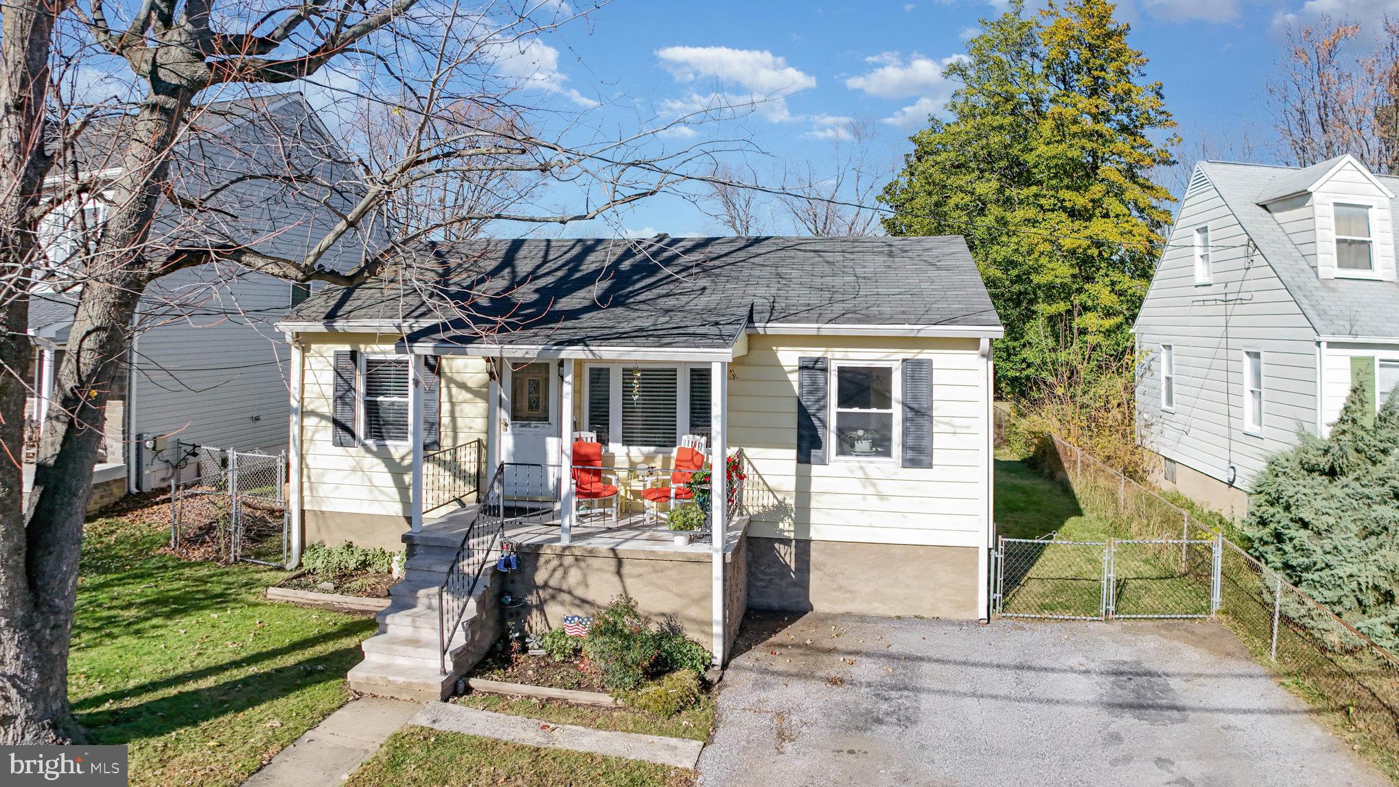7316 Hughes Avenue Baltimore, MD 21219 - Photo 3 of 43 a front view of a house with garden
