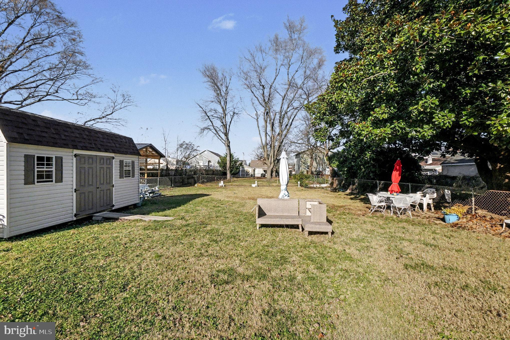 7316 Hughes Avenue Baltimore, MD 21219 - Photo 31 of 43 a view of a house with backyard and sitting area