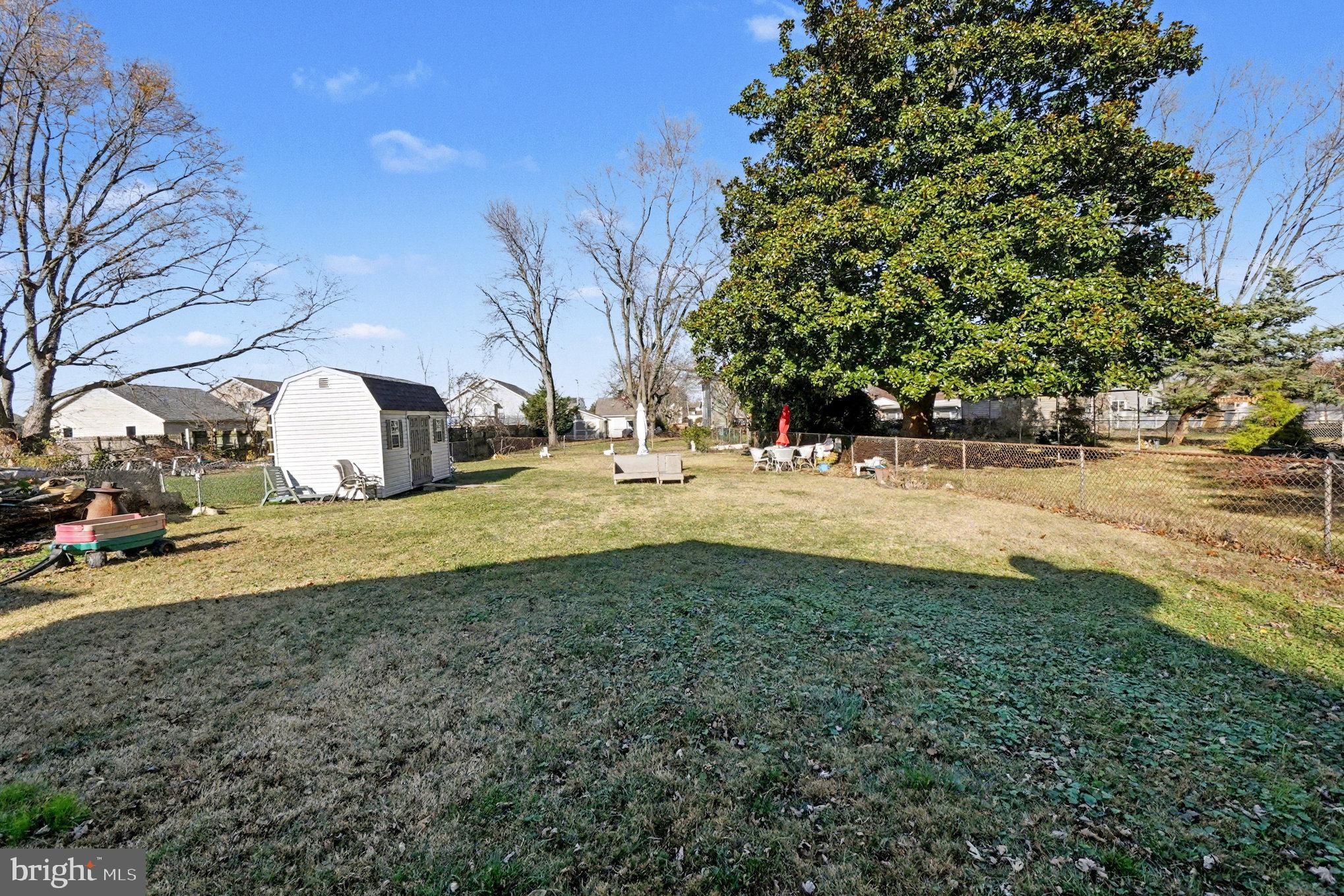 7316 Hughes Avenue Baltimore, MD 21219 - Photo 32 of 43 a view of yard with tree in it