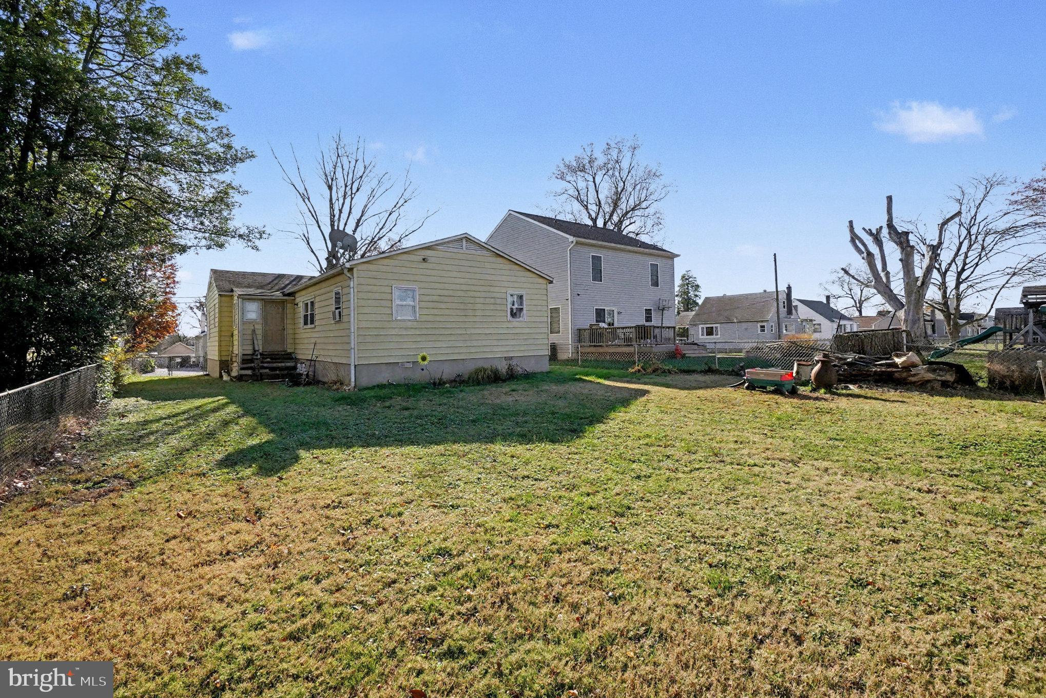 7316 Hughes Avenue Baltimore, MD 21219 - Photo 34 of 43 a view of a house with a yard