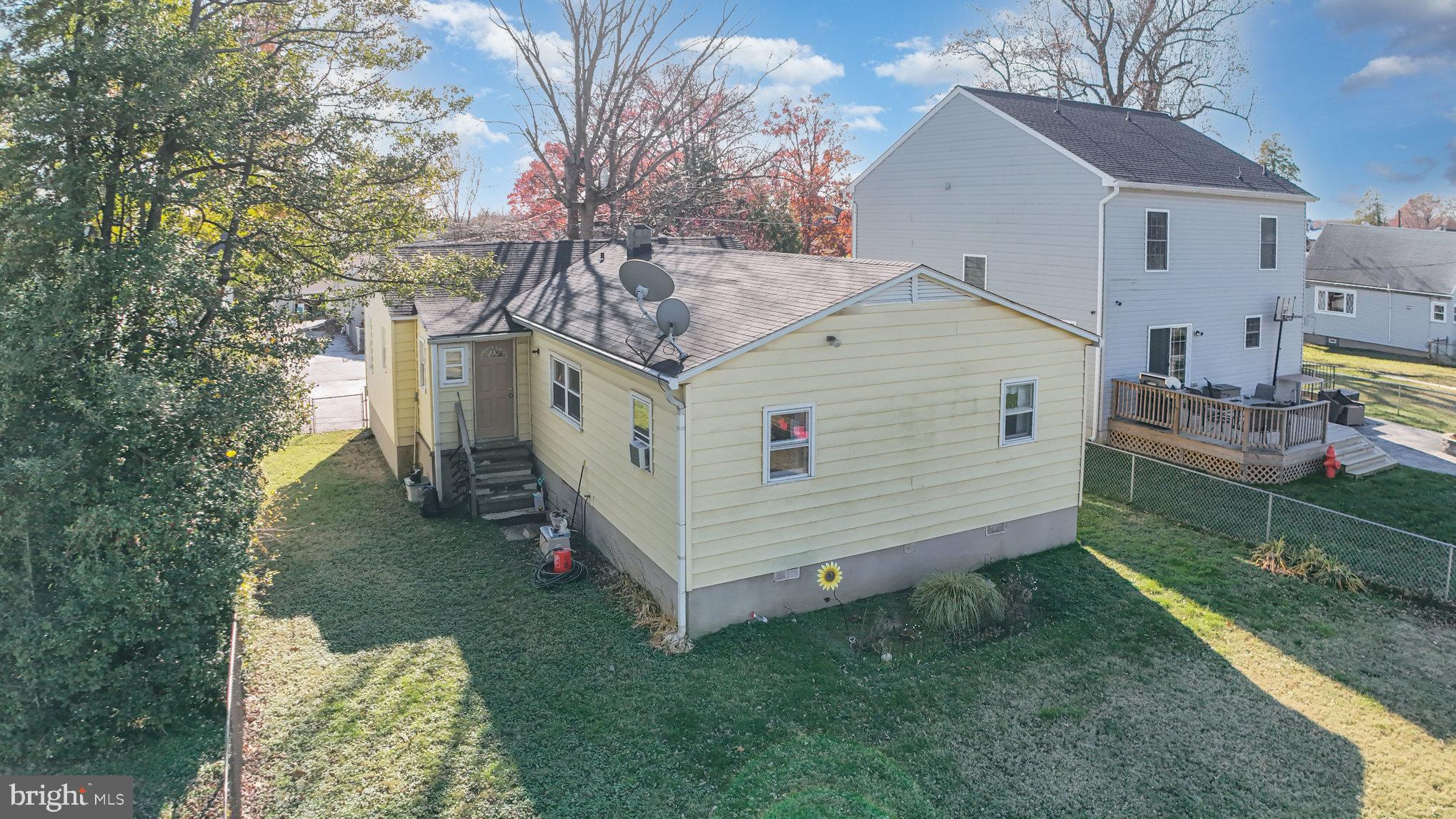 7316 Hughes Avenue Baltimore, MD 21219 - Photo 35 of 43 a view of a house with a yard